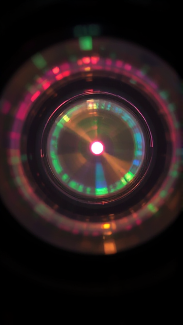 a colorful gradient of light flowing through an out of focus lense
