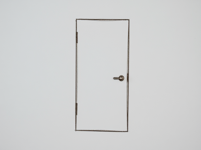 Create a barely visible outline of a hidden door, perhaps with some scratches or fingerprints near it, suggesting frequent use.