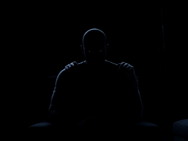 An image in the style of a Marvel Comic where a silhouette of a young bald Muslim man is seen sitting in a dark room surrounded by darkness with a separate shadow entity clinging to his shoulders only having grey eyes and on the body the entity has the word Depression on it.